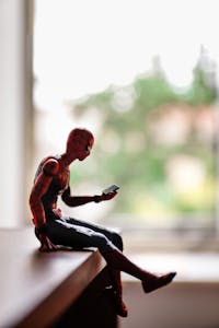 Close-up of a Spiderman Figurine Sitting on a Piece of Furniture