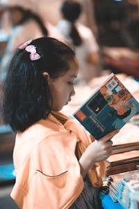 Girl Holding a Story Book