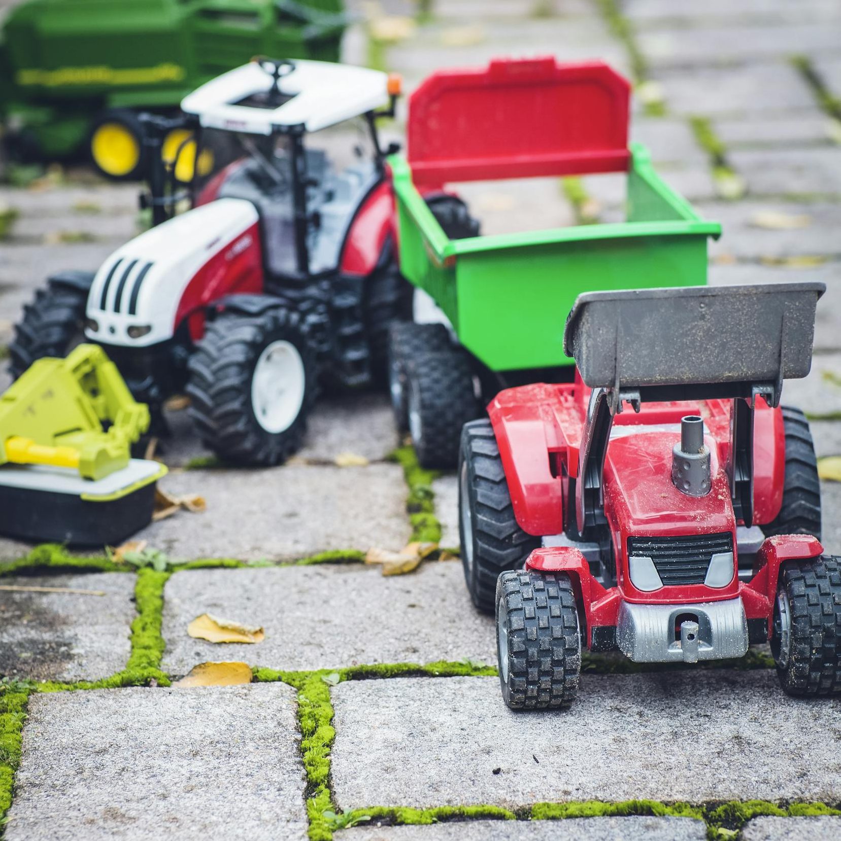 Red and Black Ride on Toy Car on Green Grass